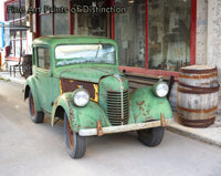 1938 Bantam Car setting in front of a closed store