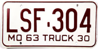 A NOS classic 1963 Missouri local truck license plate in excellent or better condition with original wrapper