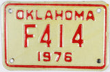 A vintage 1976 Oklahoma motorcycle license plate in excellent minus condition