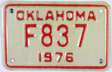 A vintage 1976 Oklahoma motorcycle license plate in excellent condition