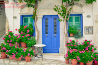 A botanical art print of Geraniums with Pink Blooms in front of a Blue Doors